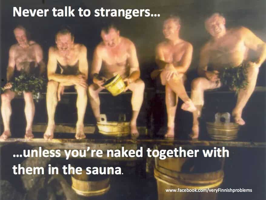 Several men sitting in a sauna